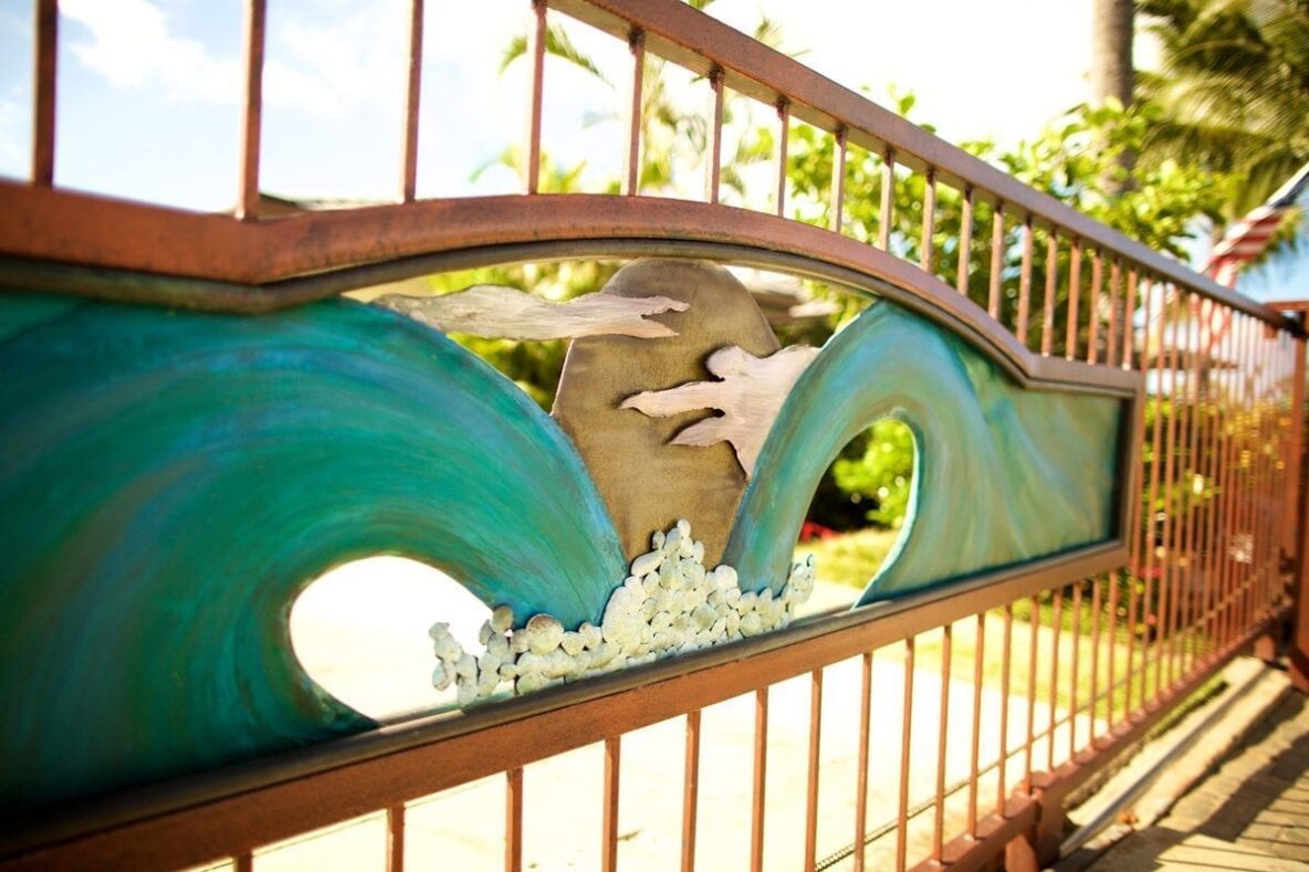 Decorative gate with ocean wave design.