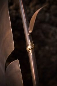 Close-up of a bamboo stalk with a knotted joint in soft lighting.