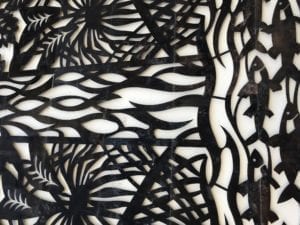 Black and white abstract geometric pattern with varied shapes and lines.
