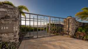 Metal gate with scenic view of ocean and plants.