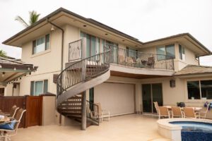 Modern house with an outdoor spiral staircase and balcony.