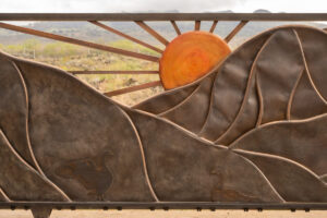 A Gate With Mountain Range With Sun Closeup View