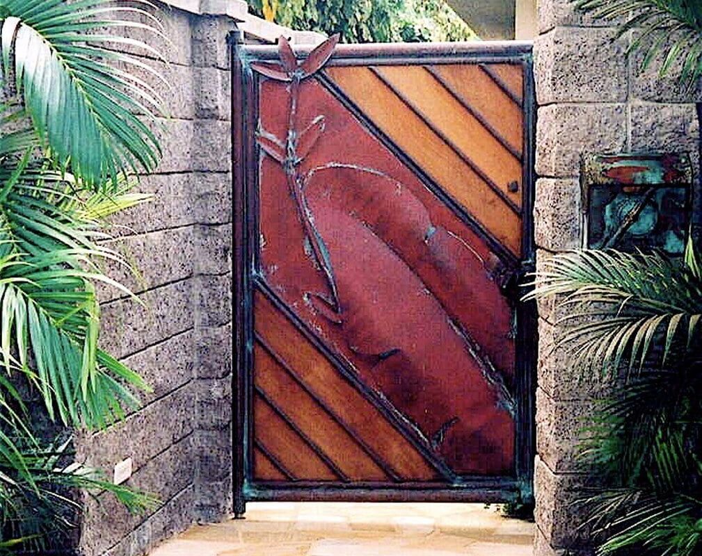 A rustic wooden gate framed by stone walls and lush greenery.