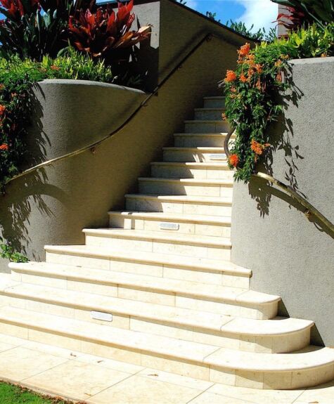 Elegant outdoor stairs with floral decorations on both sides.