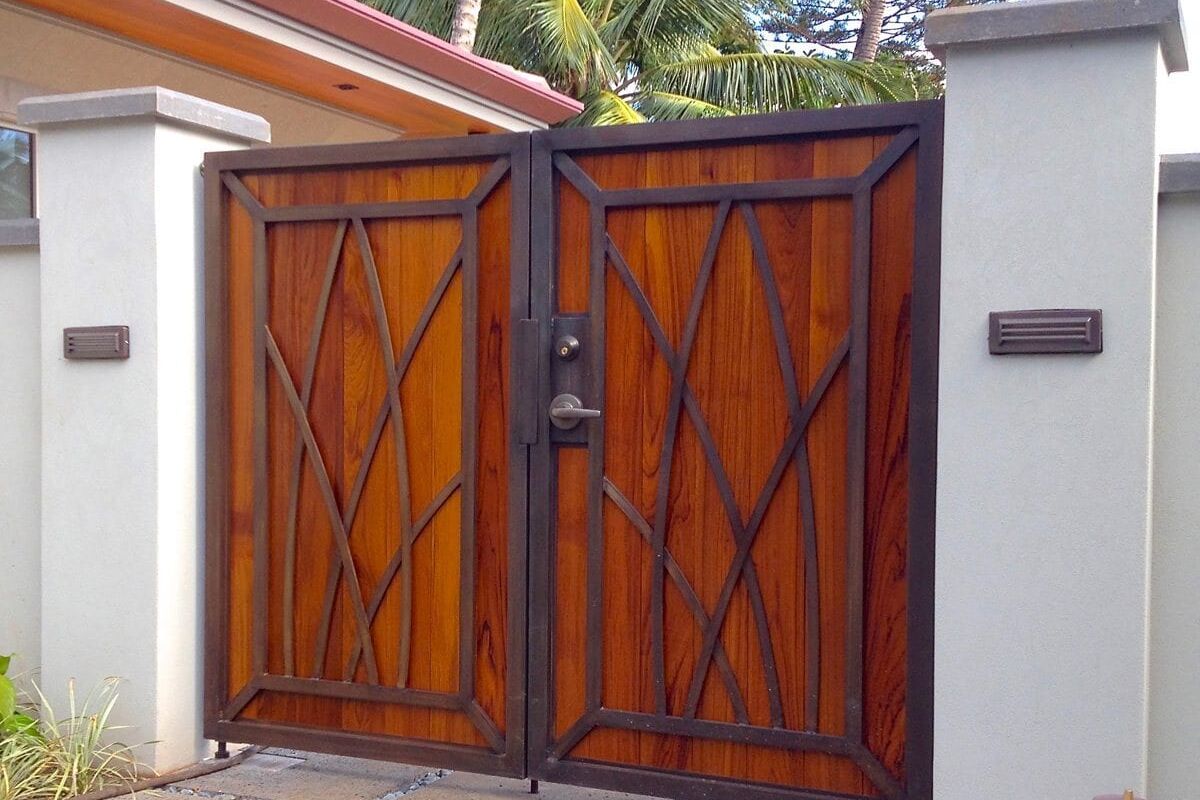 Wooden double gate with geometric iron designs.