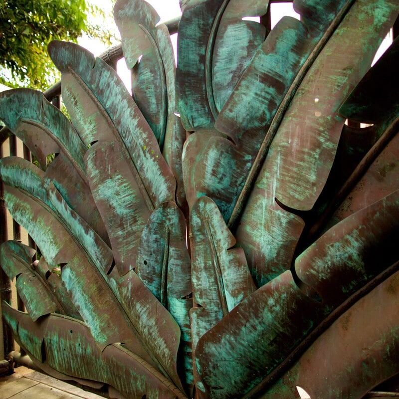 Close-up of a cluster of corroded metal objects with a greenish patina.