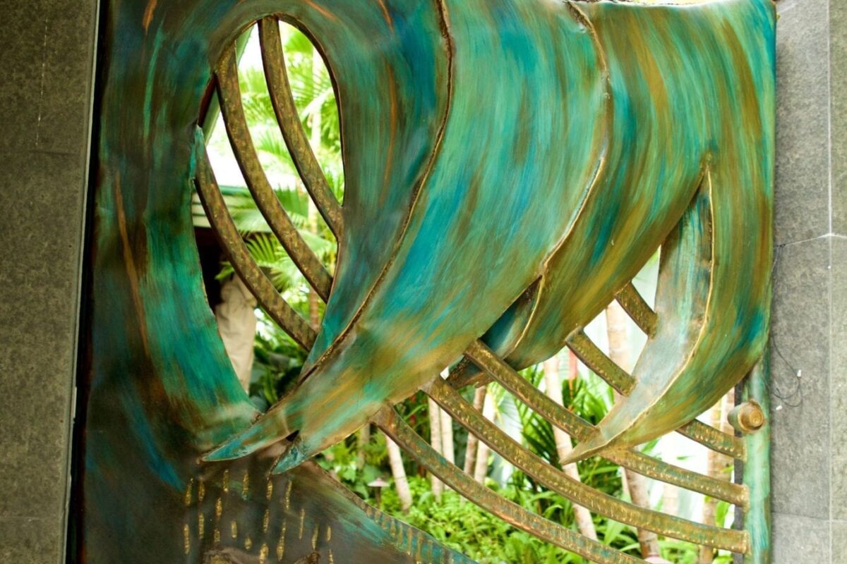 Artistic outdoor water feature with flowing water and sea-themed decorations.