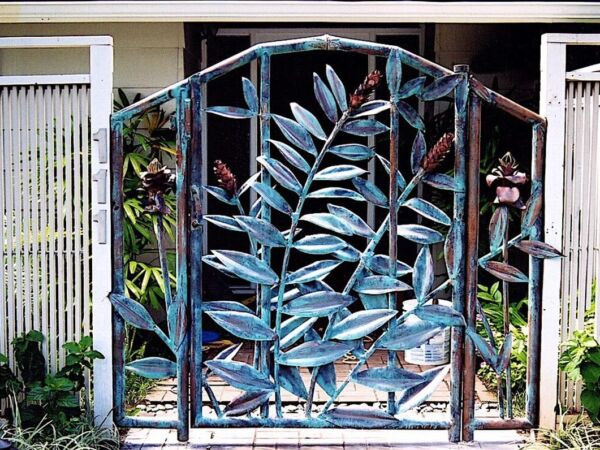 Decorative metal gate featuring intricate leaf patterns.