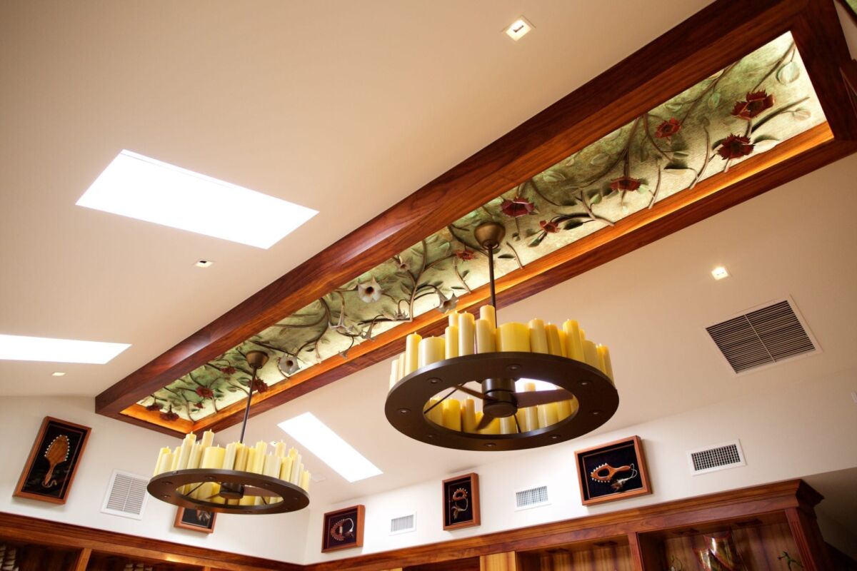 Elegant ceiling lights with a floral design in a cozy room.