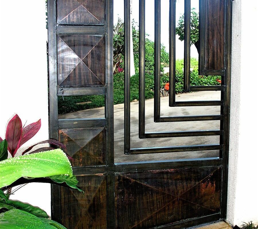 Open wooden door with glass panels overlooking a green garden.
