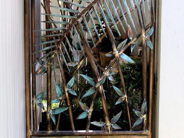 Decorative metal gate with star motifs and geometric patterns.