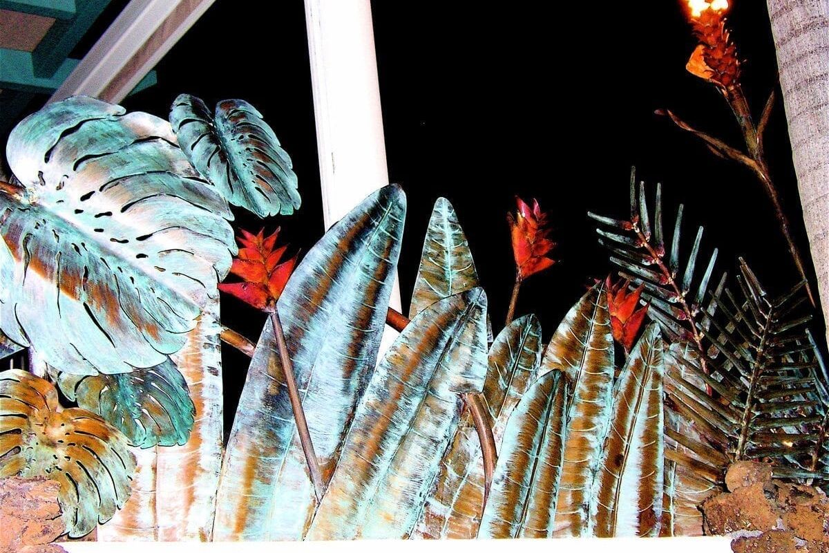 Close-up of tropical palm leaves with sunlight filtering through.