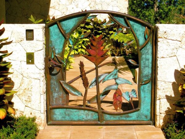Decorative garden gate featuring colorful floral and leaf designs.