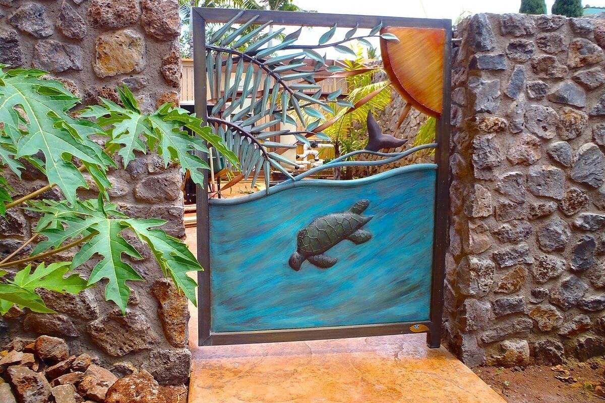 Decorative gate featuring a turtle and aquatic plants design.