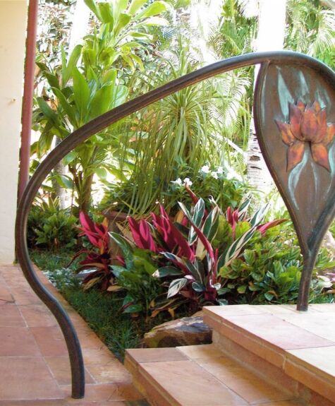 Artistic outdoor sculpture with a curved metal design and a star element.