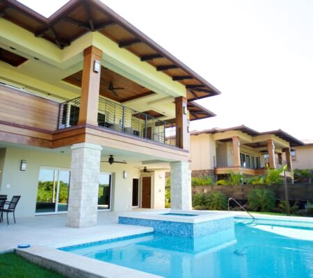 Modern villa with a spacious balcony and swimming pool.