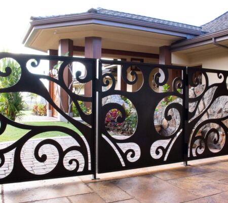 Decorative black wrought iron gate with elegant scrollwork patterns.