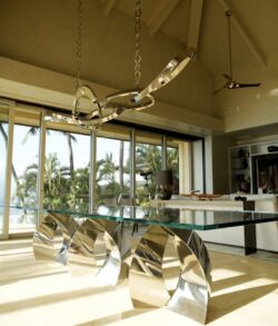 Modern interior with large windows and artistic decor pieces.
