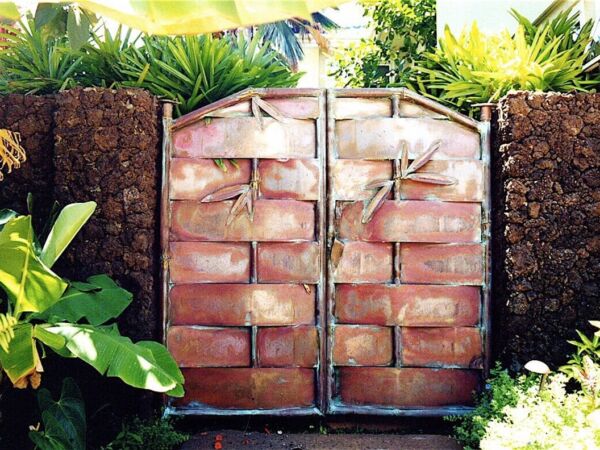 A rustic wooden gate made of stacked bricks and wood panels.