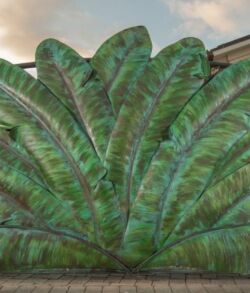 One of our favorite patina jobs, located on the west side of Maui, this entrance way has a stunning mixture of greens and light blues accenting the banana leaves using a brush technique. Large green leaves mural painted on a wall.