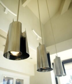 Stainless steel hanging lights Modern silver pendant lights hanging from a ceiling.