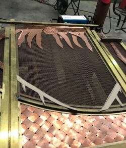 A vintage typewriter with paper inserted, showing its keys and mechanism.