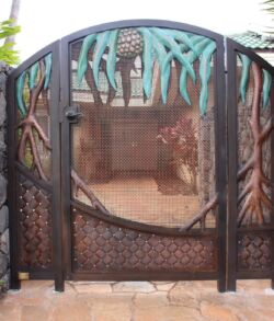 Using green and brown patina solutions we were able to bring this entrance gate modeled after the Hawaiian "Lau Hala" tree to life. Intricately designed metal gate with nature-inspired patterns.