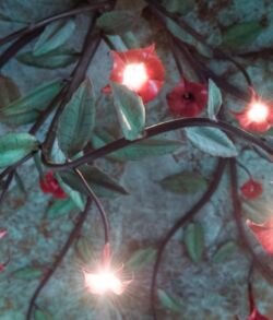 Glowing red and white lights on dark branches creating a mystical atmosphere.