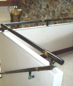 Copper and brass sculpted bamboo safety handrail Metal handrails installed on indoor stairs.
