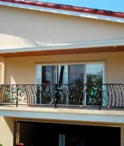 Our decorative copper and brass bamboo banister complete with bamboo leaves Modern balcony with elegant black metal railing and glass doors.