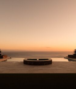 Serene sunset view over an infinity pool facing the ocean.