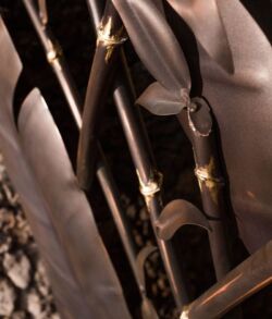 Close-up of traditional swords with decorative handles.