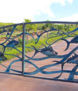 Decorative metal gate with intricate, nature-inspired designs.