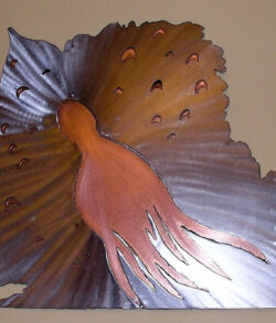 Copper and Stainless wall sculpture Decorative metal wall art resembling a bird with spread wings.