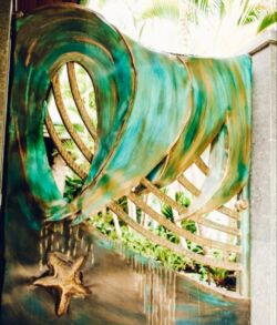 Surreal artwork of a tree blending into a swirling green structure.