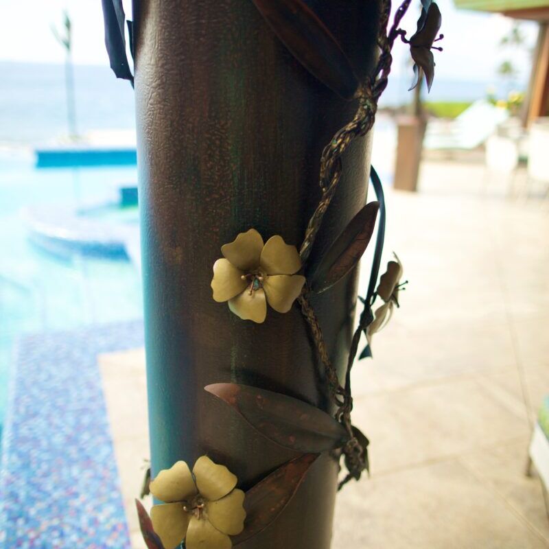 Close-up of a decorative metal pole with flower designs.