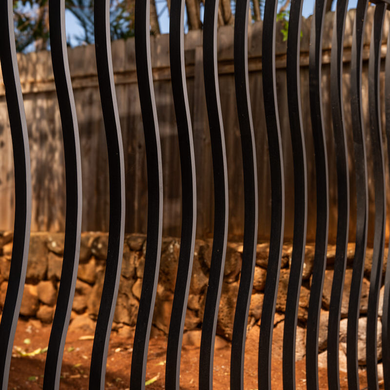 Close-up of undulating wrought iron bars