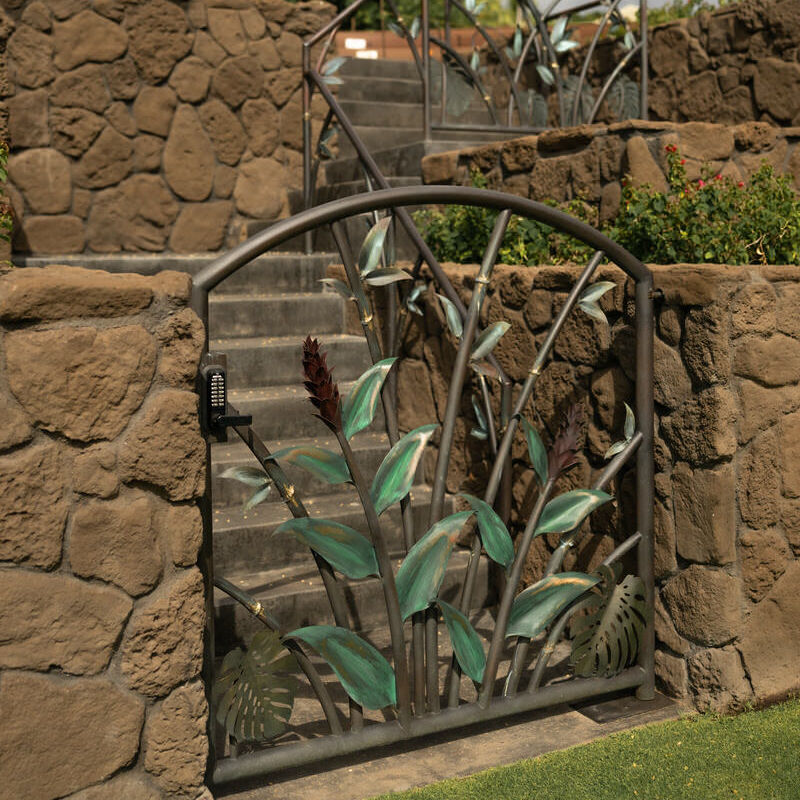 Arched garden gate with tropical leaves